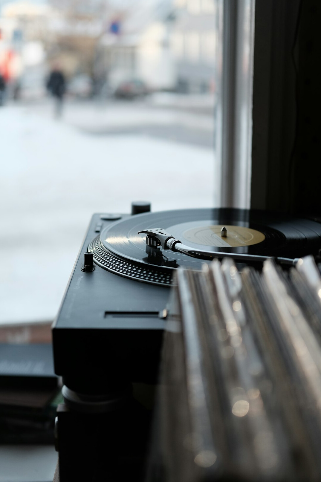 Retro analog home recording studio with mixing console and vinyl records